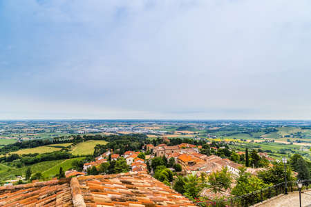 nature and memories - view from the terrace of the medieval village of bertinoro in Italy overlooking the hills of the Romagna countryside sloping down to the seaの写真素材