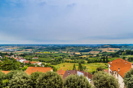nature and memories - view from the terrace of the medieval village of bertinoro in Italy overlooking the hills of the Romagna countryside sloping down to the seaの写真素材