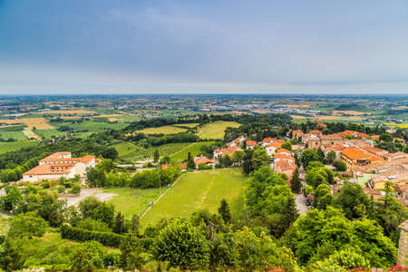 nature and memories - view from the terrace of the medieval village of bertinoro in Italy overlooking the hills of the Romagna countryside sloping down to the seaの写真素材