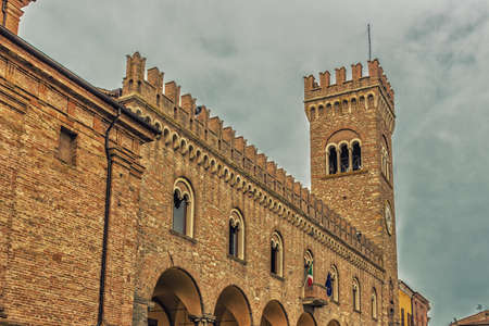 architecture in the Middle Ages - the civic tower adjacent to the town hall of bertinoro with its characteristic brick wallsの写真素材