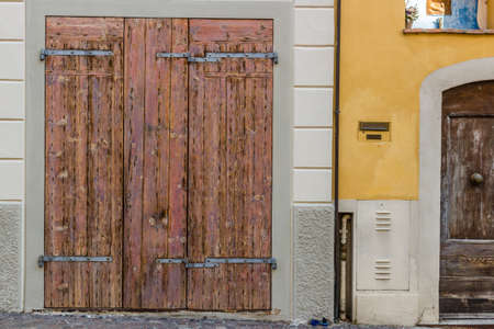 old weathered door with rusty nails and peeling copalの写真素材