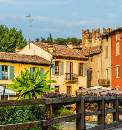 ancient buildings of a typical Italian medieval village: the river runs through the town, still passing under houses and old millsの写真素材