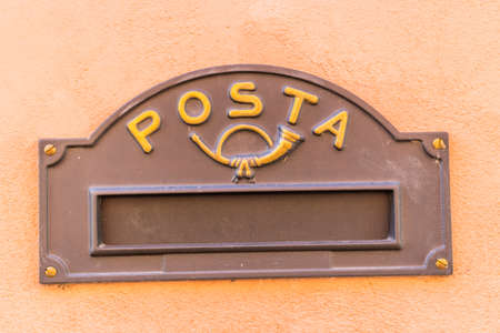 slit for inserting mail in a vintage mailbox with Italian word meaning Postの写真素材