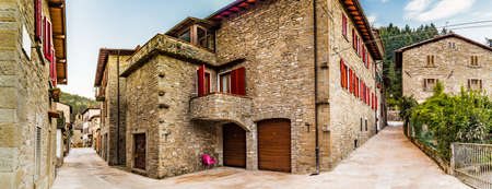 Alleys in medieval mountain village in Tuscany characterized by houses with walls of stones derived from the Renaissanceの写真素材
