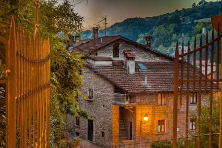 Alleys by night in medieval mountain village in Tuscany characterized by houses with walls of stones derived from the Renaissanceの写真素材