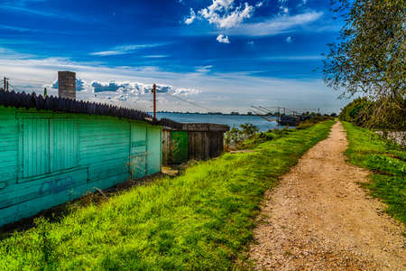 fishing huts with balance netfish in the lagoon of the valleys of Comacchio in Emilia Romagnaの写真素材
