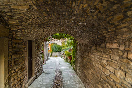 Alleys in medieval mountain village in Tuscany characterized by houses with walls of stones derived from the Renaissanceの写真素材