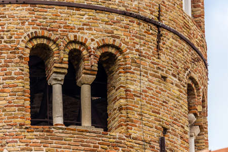 architecture details of cylindrical bell tower of the ninth century with mullioned windowsの写真素材