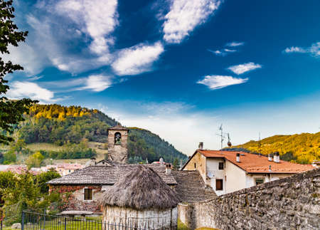 The Palace of  the Captains and a  straw hut in medieval mountain village in Tuscany characterized by houses with walls of stones derived from the Renaissanceの写真素材