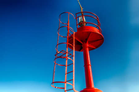 red lighthouse on a pier on  the Adriatic Seaの写真素材
