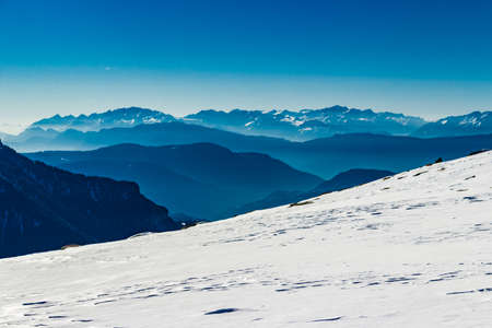 Trails on fresh snow on Dolomites Alps