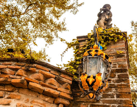 Lamp on brickwall of medieval fortressの写真素材