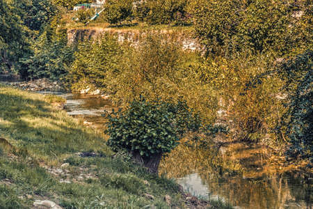 the waters of the stream Tramazzo while bathing the hill village of Tredozio in Romagna in the countryside in Northern Italyの写真素材