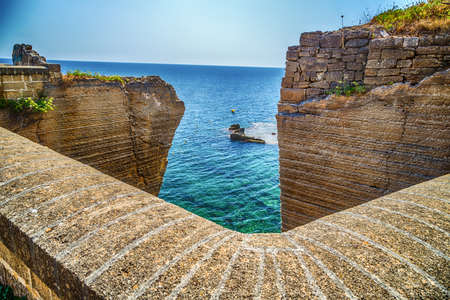 Rocks and architecture of the coast of Salento of the Ionian Sea in Italy,  in Santa Cesarea Terme, Lecce, Apuliaの写真素材