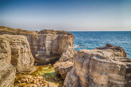 rocks and coves of the coast of Salento of the Ionian Sea in Italy,  near Tricase, Lecce, Apuliaの写真素材