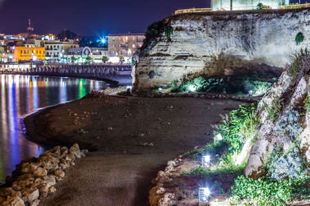 Night view of harbor of Otranto, Greek-Messapian city on the Adriatic Sea in Italyの写真素材