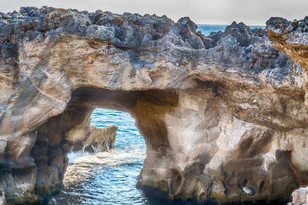 Amazing natural pool surrounded only by the Adriatic  sea or by caves in Italy,  Marina Serra Tricase, Lecce, Apuliaの写真素材