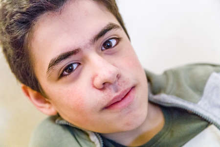 indoors close-up of smiling  caucasian teenagerの写真素材