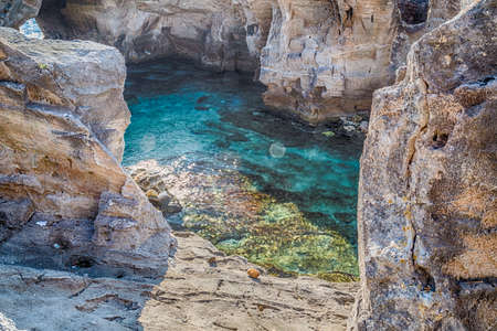Amazing natural pool surrounded only by the Adriatic  sea or by caves in Italy,  Marina Serra Tricase, Lecce, Apuliaの写真素材