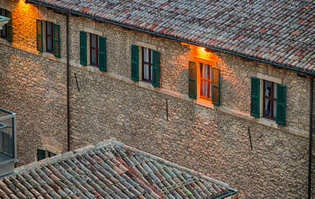 Roofs of houses of the Republic of San Marino in a winter sunsetの写真素材