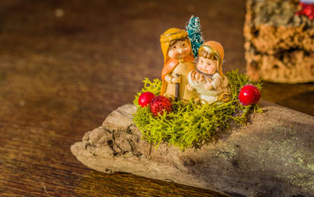 vivid colors of a Christmas Nativity scene, the Blessed Virgin Mary and Saint Joseph watch over the Holy Childの写真素材