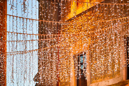 Christmas decorations and lights in the streets of a medieval townの写真素材