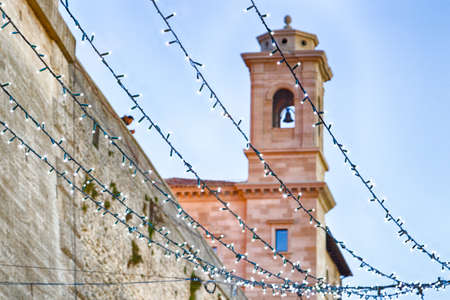 Christmas decorations and lights in the streets of a medieval town