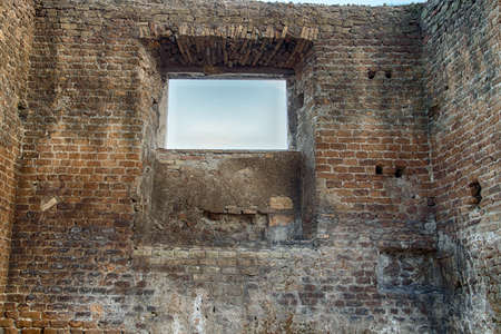 window in ancient brick wall