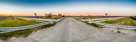 bridge on artificial water canal to irrigate the cultivated fields in the countryside of Emilia...