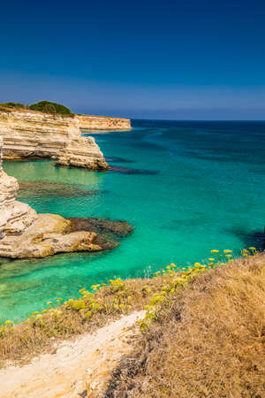 Rocky stacks of Santo Andrea on the coast of Salento in Puglia in Italyの写真素材