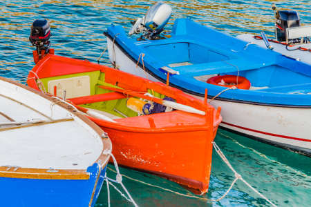 boats moored in a cove on the coast of Salento, on the Adriatic Sea in Italyの写真素材