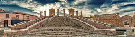 Trepponti bridge in Comacchio in Emilia Romagna, known as The Little Venice because of being an enchanting lagoon city with bridges and canals running through itの写真素材