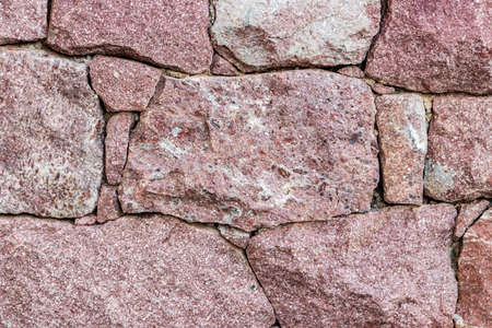 wall of reddish stonesの写真素材