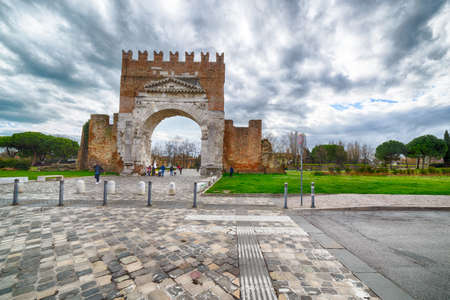 Arch of Augustus, the most ancient roman arch, entrance to the city of Rimini in Italyの写真素材