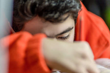 caucasian boy doing homeworksの写真素材