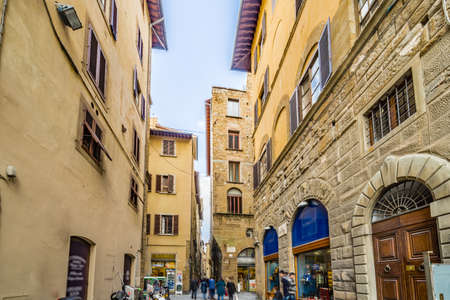 streets through historic buildings in Florence, Italyの写真素材