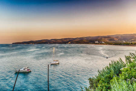 sunset on the rocky coast of Vieste in the Gargano in Puglia, Italyの写真素材
