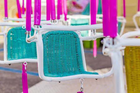 merry-go-round hanging green seatsの写真素材