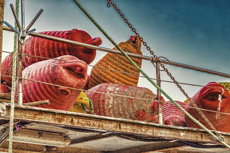 dirty floating buoys piled it on the boatの写真素材