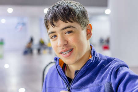 portrait of caucasian boy in the waiting room at the train station