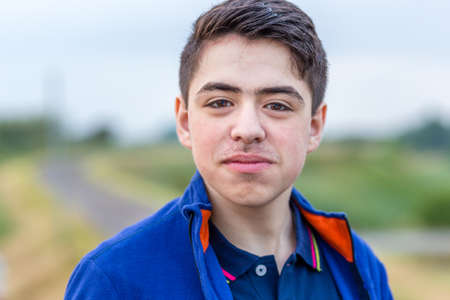 close up of young boy in countryside