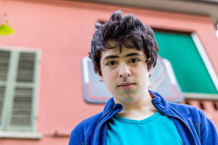 teenager portrait in the courtyard of an old houseの写真素材