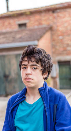 teenager portrait in the courtyard of an old houseの写真素材