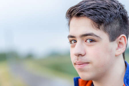 close up of young boy in countrysideの写真素材