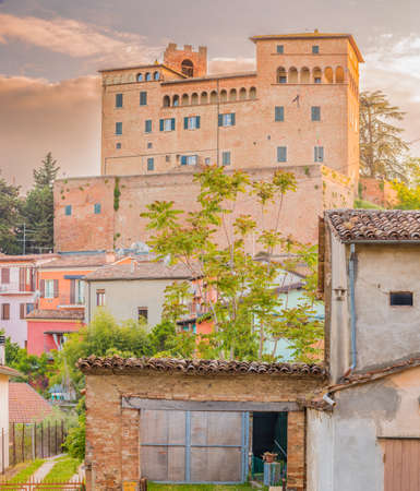 the medieval castle overlooking the colorful houses of the charming mountain town of Longiano, near Cesena, Italyのeditorial素材