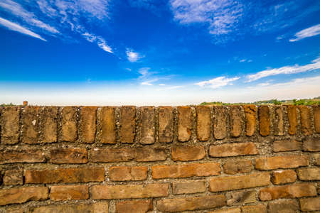 stone parapet on cloudy blue skyの写真素材