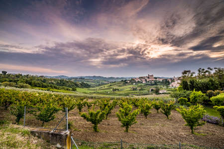 panorama of cultivated fields on the hills of Emilia Romagna dominated by Malatestian Castle,  medieval fortress dating back to 1200 AD, of Longiano, Italyのeditorial素材