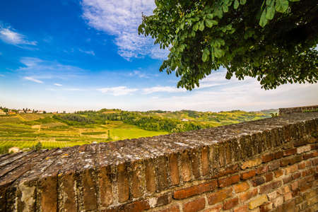 panorama of the hills of Romagna, with streets, houses and farmlands from stone parapetの写真素材