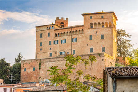the medieval castle overlooking the colorful houses of the charming mountain town of Longiano, near Cesena, Italyのeditorial素材
