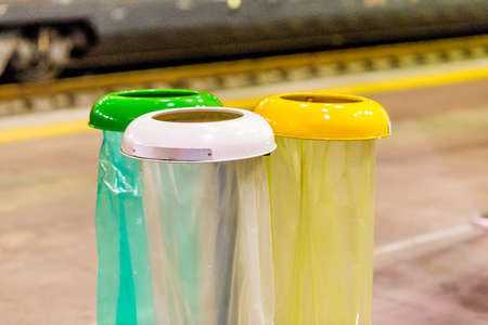 separate collection of waste, yellow container for plastic, white for paper and green for other...